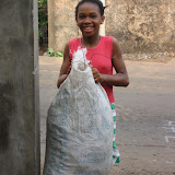  &ndash; Lucy carrying out trash (James Mansaray, photographer) 2007