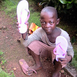  &ndash; Child receiving flip flops (picture taken by James Mansaray)
