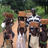  &ndash; James with children helping to build a house.