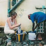  &ndash; Crystal and Kadijah doing Laundry 2002 (James B. Mansaray, photographer)