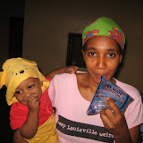  &ndash; Kadijah with Roo and bags of water. (James Mansaray, photographer)
