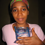  &ndash; Kadijah with pure water provided by Nazareth House support. June 2007 (James Mansaray, photographer)