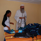  &ndash; Kadijah and Fr. Seraphim examine the uniforms...© 2008 Nazareth House Media, JBM photographer