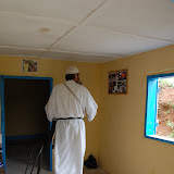  &ndash; Father walks into the School Office and finds pictures of dear friends and family posted on wall of office..© 2008 September Nazareth House Apostolate Media, James B. Mansaray, photographer.