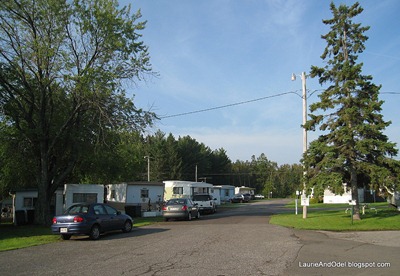Row of single wide mobile homes.