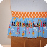 crayon apron toyland orange dots display detail