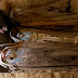An Egyptian worker, seen by ancient Pharaonic sarcophagus inside a rock-cut tombs dating to the Middle Kingdom (ca. 2061-1786 BC) which has been discovered recently by an Egyptian archaeological mission sponsored by the Supreme Council of Antiquities (SCA) southeastern part of the pyramid field of Illahun, in Egypt's Fayoum region, Sunday April 26, 2009. (AP Photo/Amr Nabil)