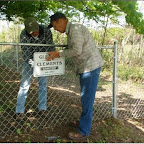 Placing the sign on the fence