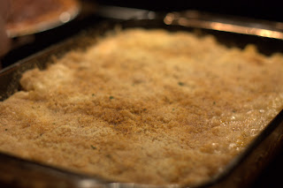 picture of mac <br />n' cheese after it has been baked golden brown