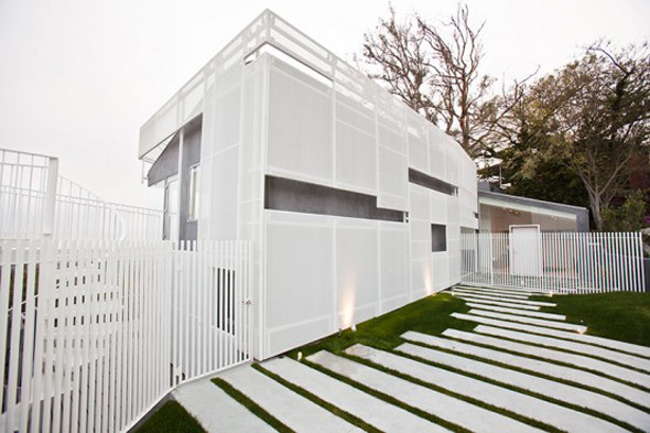 modern white aggressively sloping site house