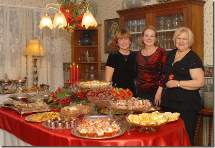 Deborah Cote/News Tribune
From left, Patti Dudenhoeffer, Deanna Haslag and Belinda Heimericks  all members of St. Andrews Catholic Church in Holts Summit. Each year these three women and their husbands (not pictured) put together a Christmas Open House at the Dudenhoeffer residence in Holts Summit for members of thier church come together and enjoy one anothers company while sharing some holiday cheer.