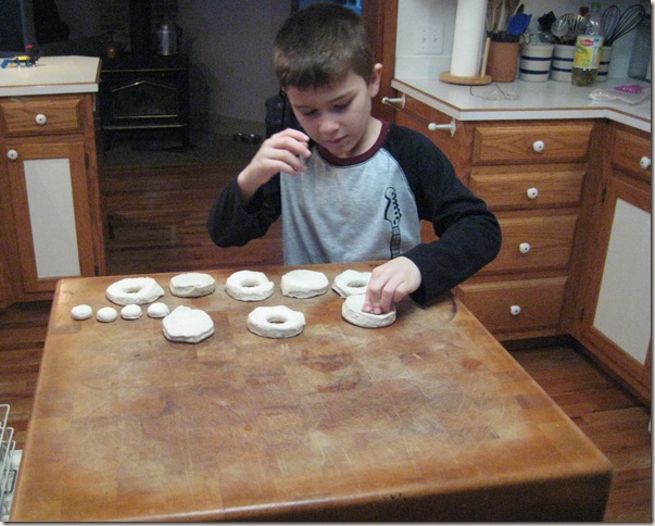 Allen cutting holes in the biscuits