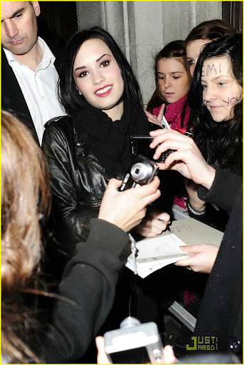 37123, LONDON, UNITED KINGDOM - Sunday January 24, 2010. Demi Lovato leaves Radio One studios after appearing on the 'Switch' show with DJs Nick Grimshaw and Annie Mac. Demi is swarmed by fans as she signs autographs and poses for pictures. Back at her hotel she is greeted by more fans waiting for her outside, some reportedly had been waiting for her overnight. Photograph: Ringo, PacificCoastNews.com **FEE MUST BE AGREED PRIOR TO USAGE****E-TABLET & MOBILE PHONE APP PUBLISHING REQUIRES ADDITIONAL FEES** UK OFFICE:+44 131 557 7760/7761 US OFFICE:1 310 261 9676