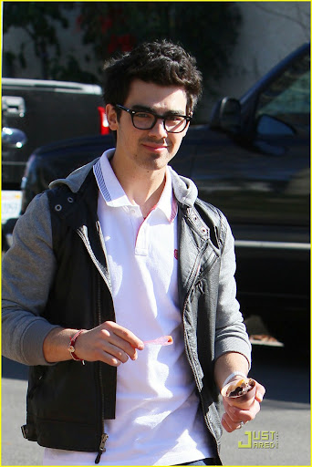 37566, LOS ANGELES, CALIFORNIA - Wednesday February 10, 2010. **EXCLUSIVE** Nick (left) and Joe (right) Jonas share a laugh after getting ice cream together in LA. Joe walked Nick to his truck and gave him a brotherly hug before departing. Joe Jonas, looking fashionable in his two-tone jacket and thick frame glasses, is seen wearing Nike high top sneakers. Nick, on the other hand, kept it more casual in an open button up shirt and shoulder bag worn with dark denim pants and black boots. Photograph: Anthony, PacificCoastNews.com**FEE MUST BE AGREED PRIOR TO USAGE** **E-TABLET/IPAD & MOBILE PHONE APP PUBLISHING REQUIRES ADDITIONAL FEES** UK OFFICE:+44 131 557 7760/7761 US OFFICE:1 310 261 9676
