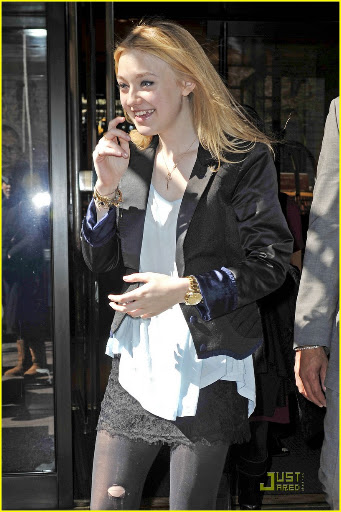 38650, NEW YORK, NEW YORK - Tuesday March 16, 2010. Dakota Fanning stops to pose with her young fans as she steps out of her NYC hotel wearing a lacy skirt with stockings and a black blazer. The 16 year old actress is currently promoting her latest flick "The Runaways" with co-star Kristin Stewart. Photograph: PacificCoastNews.com**FEE MUST BE AGREED PRIOR TO USAGE** **E-TABLET/IPAD & MOBILE PHONE APP PUBLISHING REQUIRES ADDITIONAL FEES** UK OFFICE:+44 131 557 7760/7761 US OFFICE:1 310 261 9676