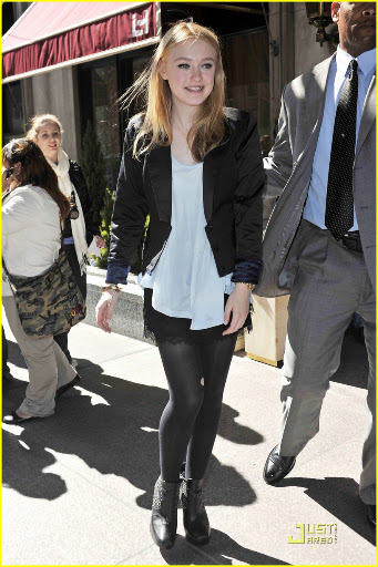 38650, NEW YORK, NEW YORK - Tuesday March 16, 2010. Dakota Fanning stops to pose with her young fans as she steps out of her NYC hotel wearing a lacy skirt with stockings and a black blazer. The 16 year old actress is currently promoting her latest flick "The Runaways" with co-star Kristin Stewart. Photograph: PacificCoastNews.com**FEE MUST BE AGREED PRIOR TO USAGE** **E-TABLET/IPAD & MOBILE PHONE APP PUBLISHING REQUIRES ADDITIONAL FEES** UK OFFICE:+44 131 557 7760/7761 US OFFICE:1 310 261 9676