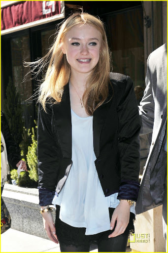 38650, NEW YORK, NEW YORK - Tuesday March 16, 2010. Dakota Fanning stops to pose with her young fans as she steps out of her NYC hotel wearing a lacy skirt with stockings and a black blazer. The 16 year old actress is currently promoting her latest flick "The Runaways" with co-star Kristin Stewart. Photograph: PacificCoastNews.com**FEE MUST BE AGREED PRIOR TO USAGE** **E-TABLET/IPAD & MOBILE PHONE APP PUBLISHING REQUIRES ADDITIONAL FEES** UK OFFICE:+44 131 557 7760/7761 US OFFICE:1 310 261 9676