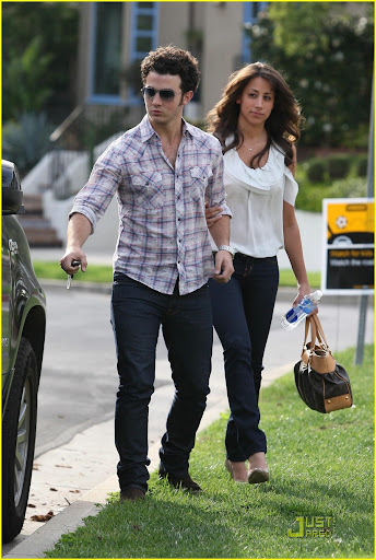Kevin Jonas acts like the perfect gentleman, opening the car door for his new wife Danielle in Toluca Lake, as they leave his parents home
Los Angeles, California - 21.03.10
Mandatory credit: WENN.com