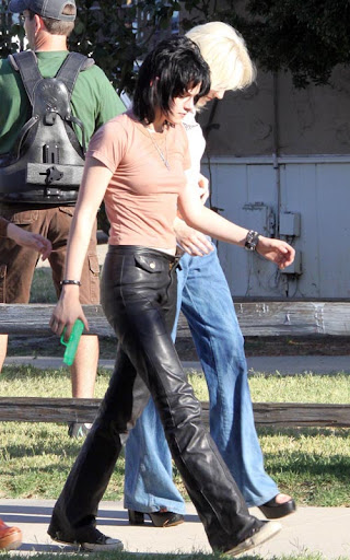 07-22-09 Los Angeles, CAActresses Kristen Stewart and Dakota Fanning on the set of their upcoming movie 'The Runaways' in Los Angeles. In a couple scenes Kristen has a neon green water gun stuffed in the front of her pants...Non-Exclusive Pix by Flynet ©2009818-307-4813  Nicolas310-869-0177  Scott