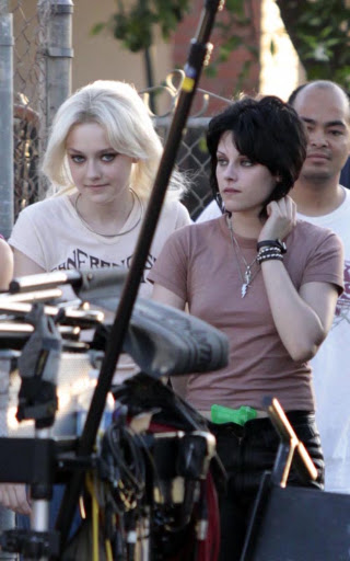 07-22-09 Los Angeles, CAActresses Kristen Stewart and Dakota Fanning on the set of their upcoming movie 'The Runaways' in Los Angeles. In a couple scenes Kristen has a neon green water gun stuffed in the front of her pants...Non-Exclusive Pix by Flynet ©2009818-307-4813  Nicolas310-869-0177  Scott