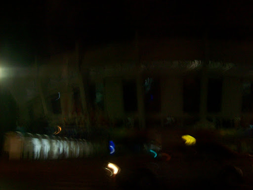 Blurry taxi ride picture of Shanghai Stadium where soccer is being played.