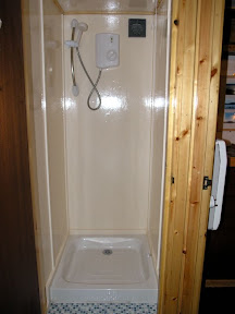 Downstairs shower with newly tiled floor.