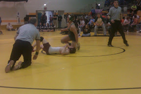 Pella's A.J. Arrendell reacts to winning the 189 pound Little Hawkeye Conference title.