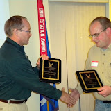 FAA Safety Team Program Manager Chris Manthe presents Shane Vande Voort with two flight awards (photo courtesy Classic Aviation)