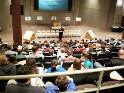 Parents and students take part in a quiz at "Explore Engineering" at Pella Corporation