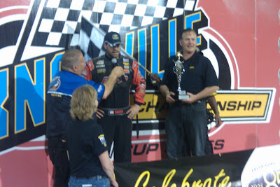 Brian Brown in victory lane talking to Mike Roberts on Saturday.