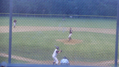 Jon Holwerda Delivers Pitch to Oskaloosa batter