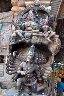 Ancient statue of Ravana with Rama and Sita enthroned above him