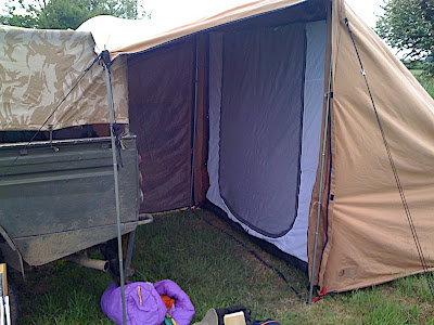 The Tent with one side-wing zipped off, showing the inner tent and mozzie net etc.
