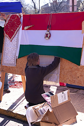 Monika hanging up some traditional Hungarian table cloths.