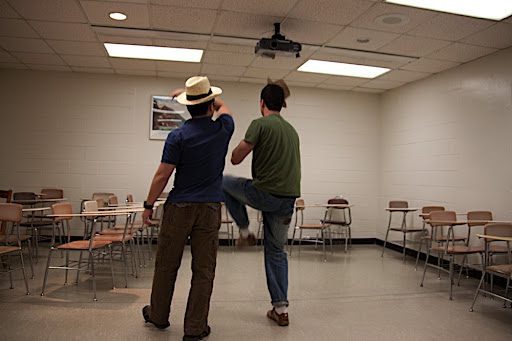 Dan knocks off Gabor's hat.