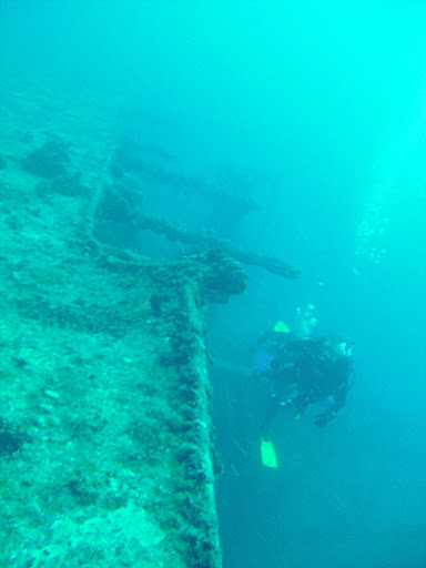 Taken from the back of the ship, looking forward. Two divers return from their dive just as we get down to do our own diving. They were part of the same dive boat.