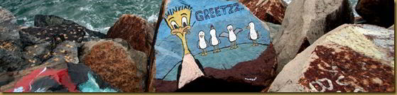 Bird mural on rock