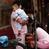 Babies & small children all  over China had pants  without "bottoms" so that  they could be held over  streets and trash cans to  poop and pee.  At first I thought the spitting was the grossest thing.
