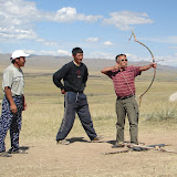 Our driver and the roadside  archery hosts.  Is it more  disturbing that Kristofer &  I were better at archery than  they were or that Kristofer was  wearing his jean rolled up like that?
