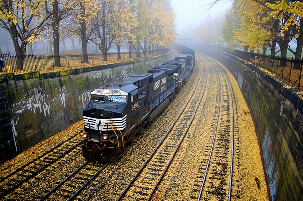 Train goes through the lonely railroad in West Park, Pittsburgh, Pennsylvania, USA while the dense, cold fog hangs on through the morning. Train goes through the lonely railroad in West Park, Pittsburgh, Pennsylvania, USA while the dense, cold fog hangs on through the morning.