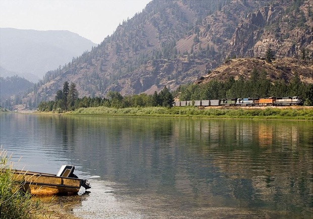 Train runs through the green at Perma, Montana, USA