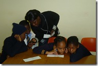Teacher & students looking at the phones