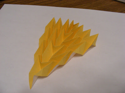 Collapsed diagonal v-shaped origami accordion top view