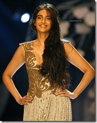 Bollywood actor Sonam Kapoor displays a creation by designer Anamika Khanna on the fourth day of the HDIL India Couture Week in Mumbai, India, Friday, Sept. 19, 2008