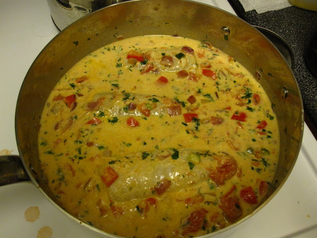 Stewing the fish after adding the coconut milk Stewing the fish after adding the coconut milk