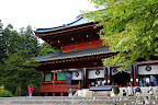 Aya approaches Sanbutsudo of the Rinnoji Temple area of Nikko Japan