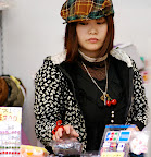 I wonder what that red-ribbon on her finger is supposed to remind her of?