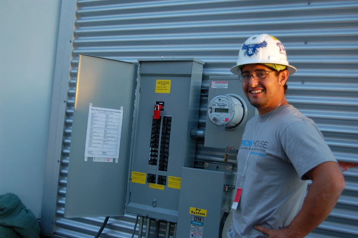 Roque, our engineering lead, smiling because the ZEROW is hooked up to the Solar Village mini-grid, and is producing solar powered electricity.