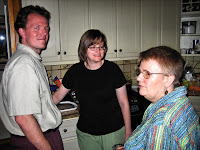 Brent, Wendy, and Robin talk in the kitchen