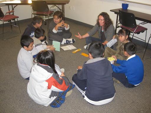 Marie, from P-Patch, teaches students the science behind gardening
